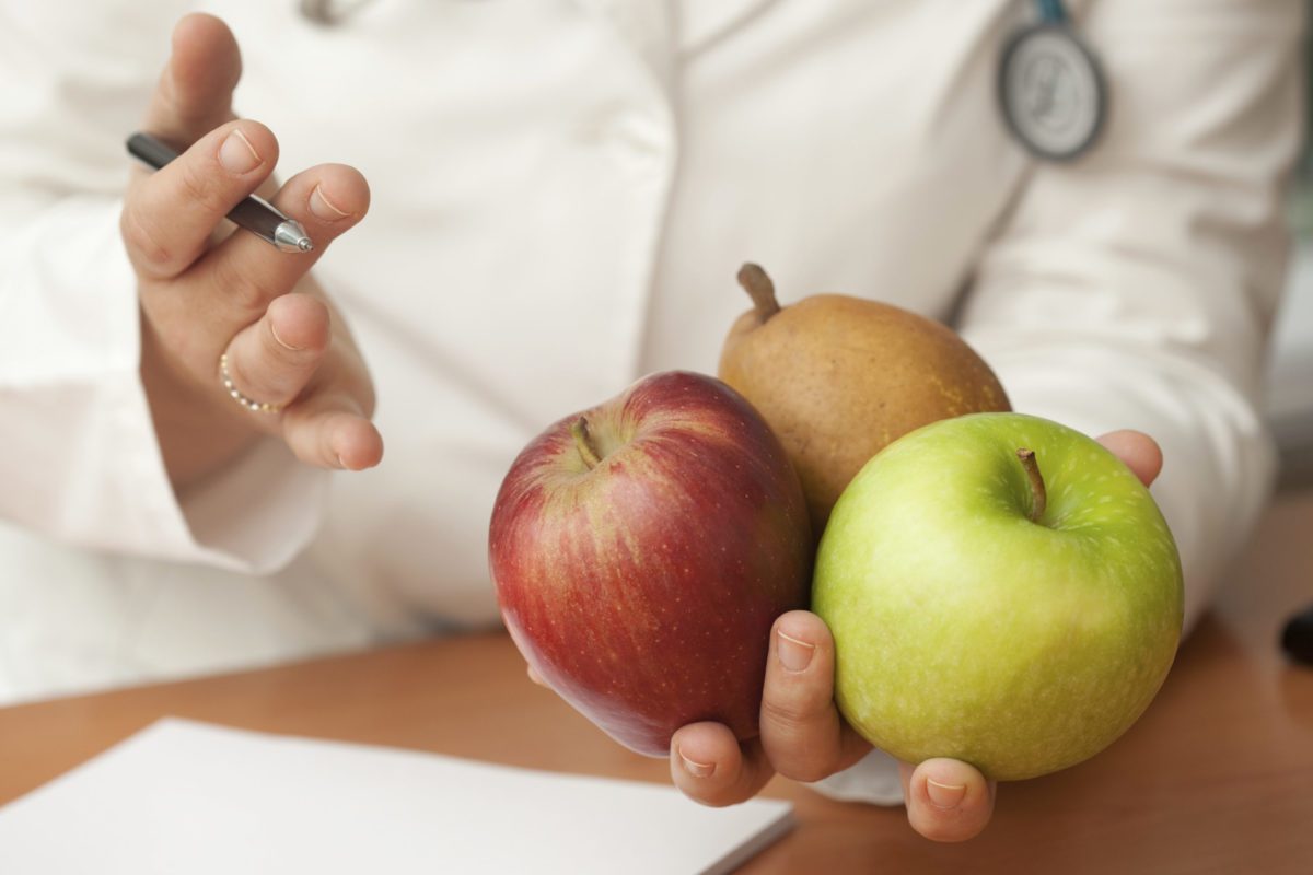 dietitian holding apples