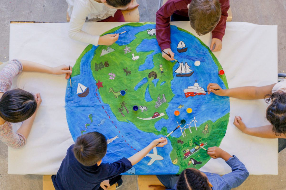 Kids painting globe picture