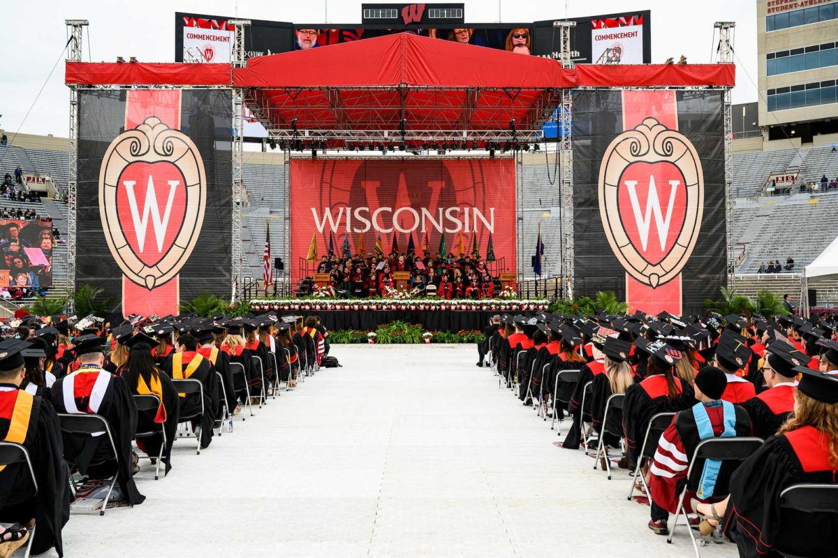 stage at 2019 uw-Madison graduation, surrounded by seated students ready to graduate