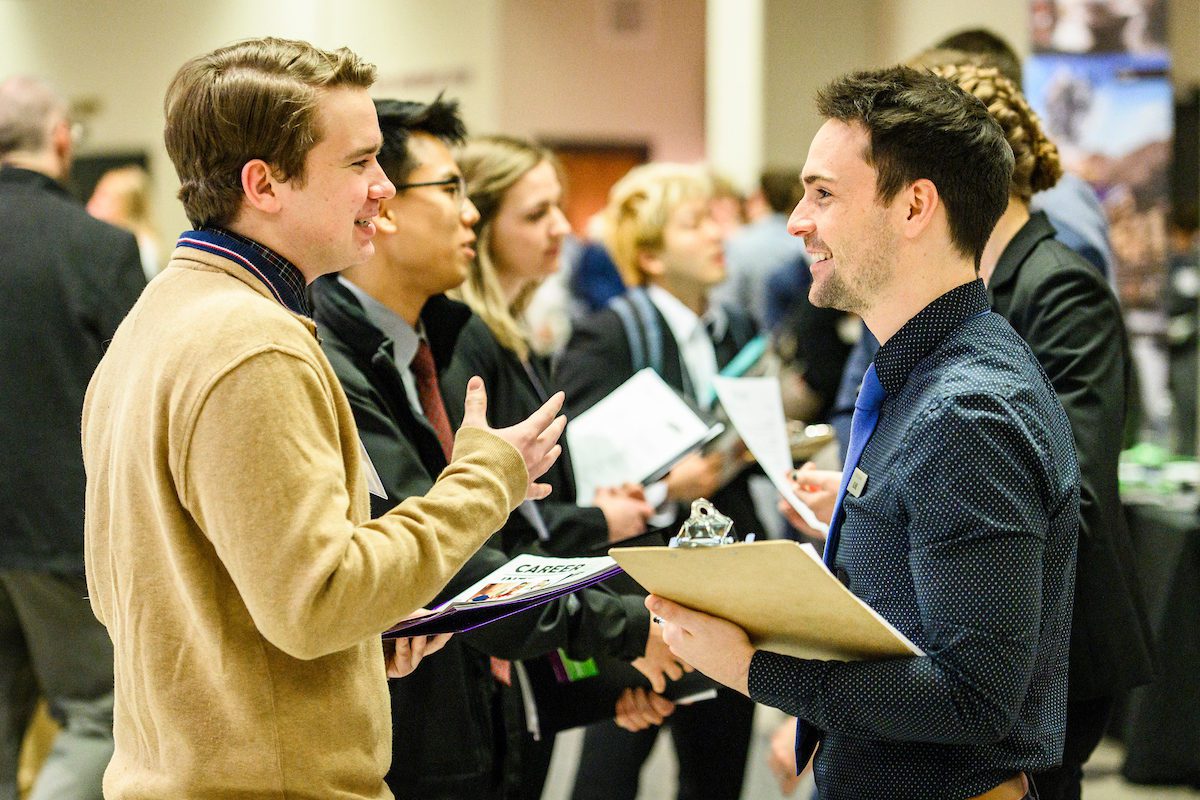 Undergraduate Kevin Lussky (left) talks with a recruiter from Uline during the annual Spring Career and Internship Fair held at the Kohl Center at the University of Wisconsin-Madison on Feb. 5, 2019. The fair featured 215 employers and was open to all current students and alumni.