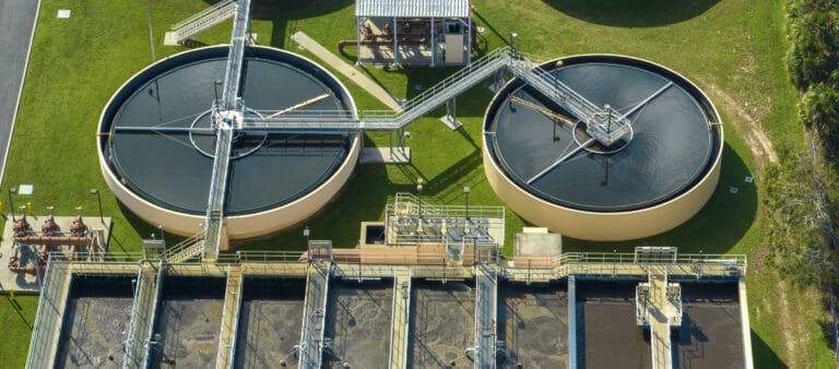 Aerial view of modern water cleaning facility at urban wastewater treatment plant.