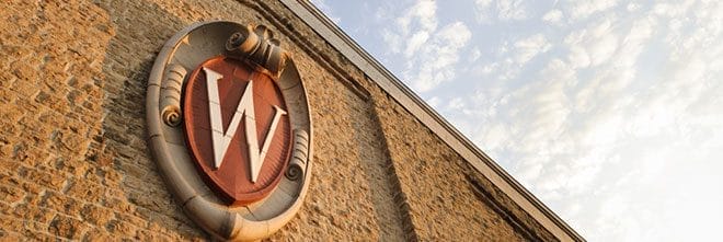 The University of Wisconsin-Madison crest on a brick buulding