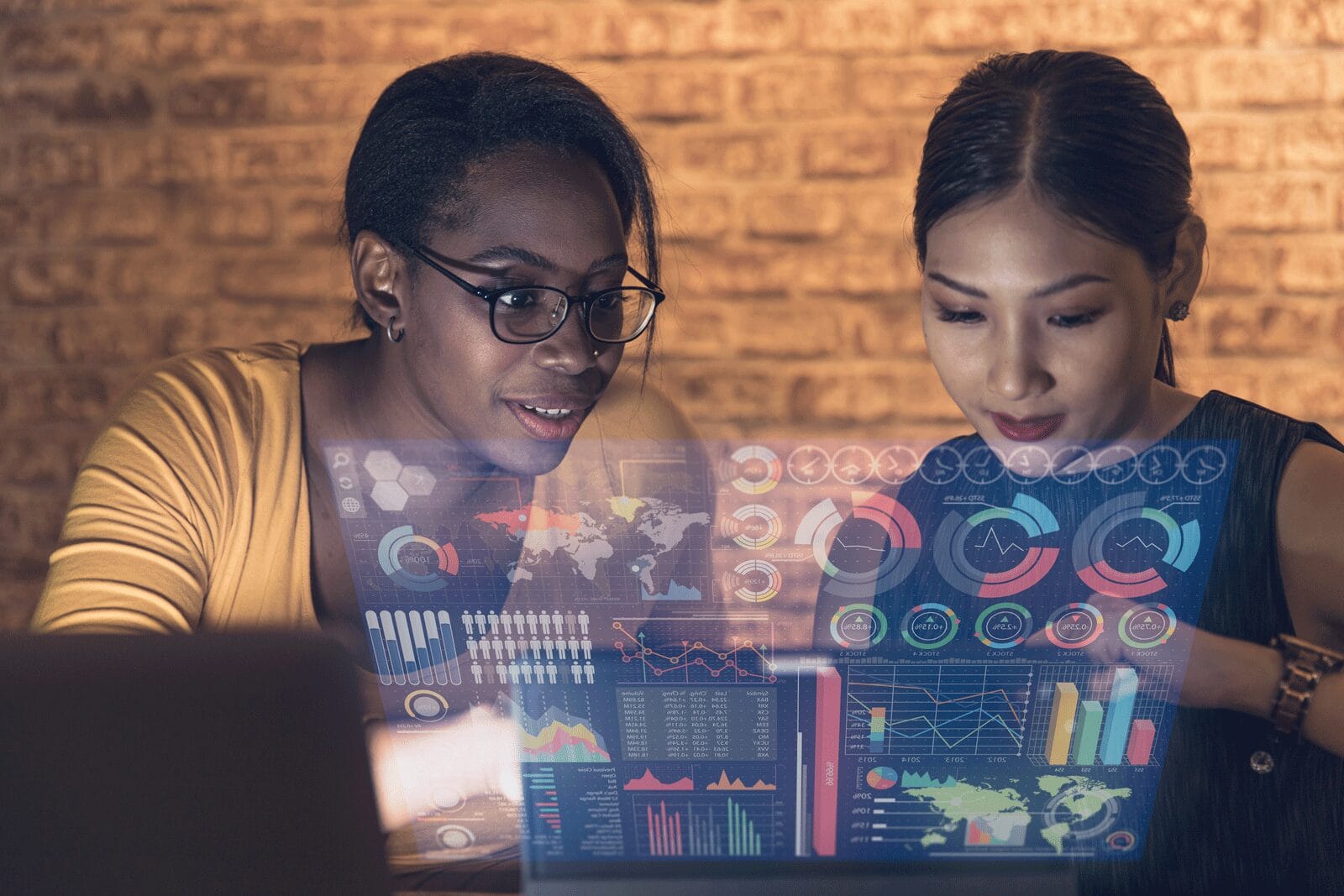 Two women scrolling on a tablet