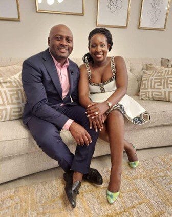 Sammy and his wife Claire sitting on a couch, in fancy clothes