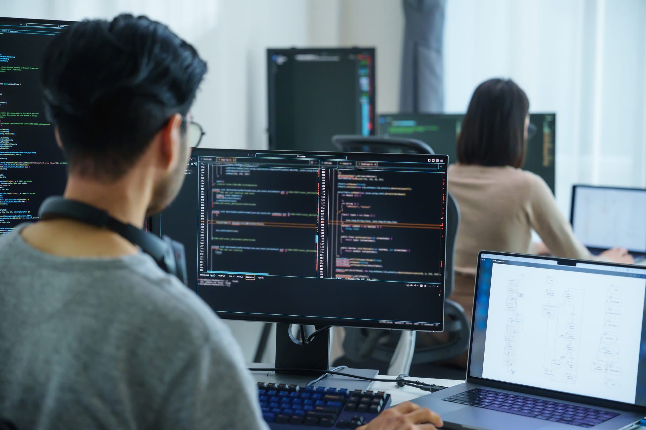 Man working on code on his computer