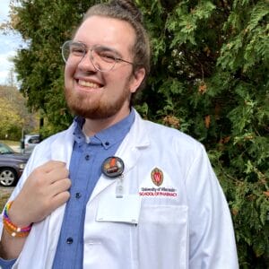 Vincent Wartneweiler smiling in his UW lab coat