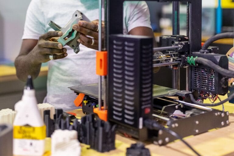 Closeup of a man working on a circuit board