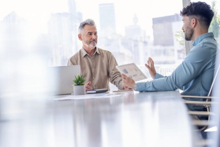 Two professionals holding a meeting in a conference room