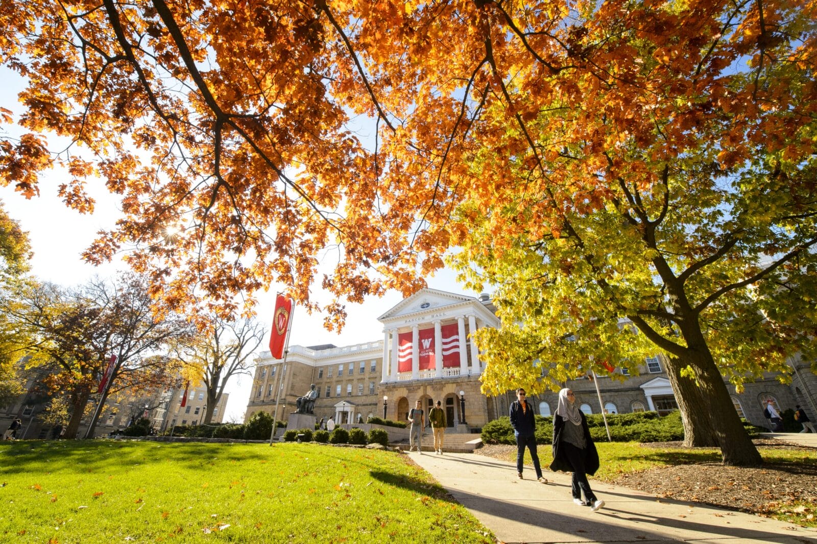 Four students outside Bascom Hall.