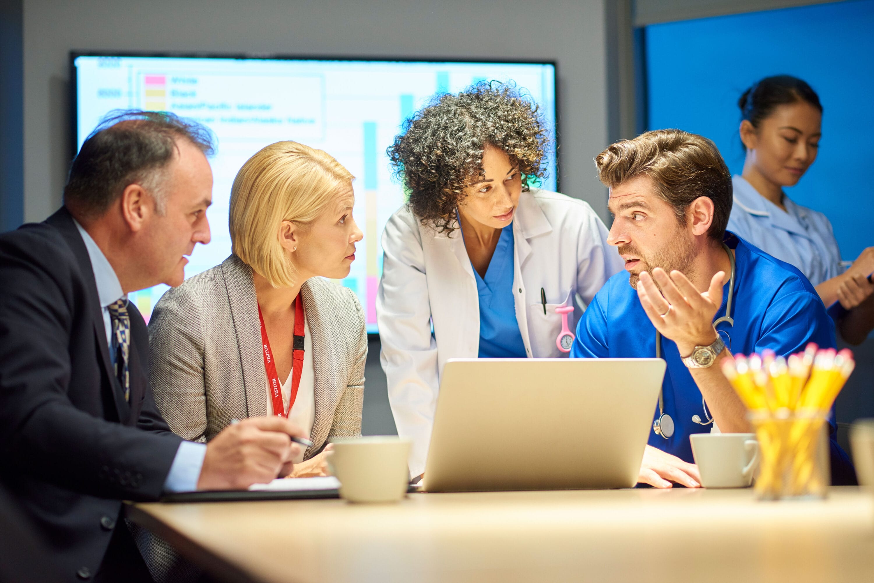 A group of medical professional meeting for a briefing.