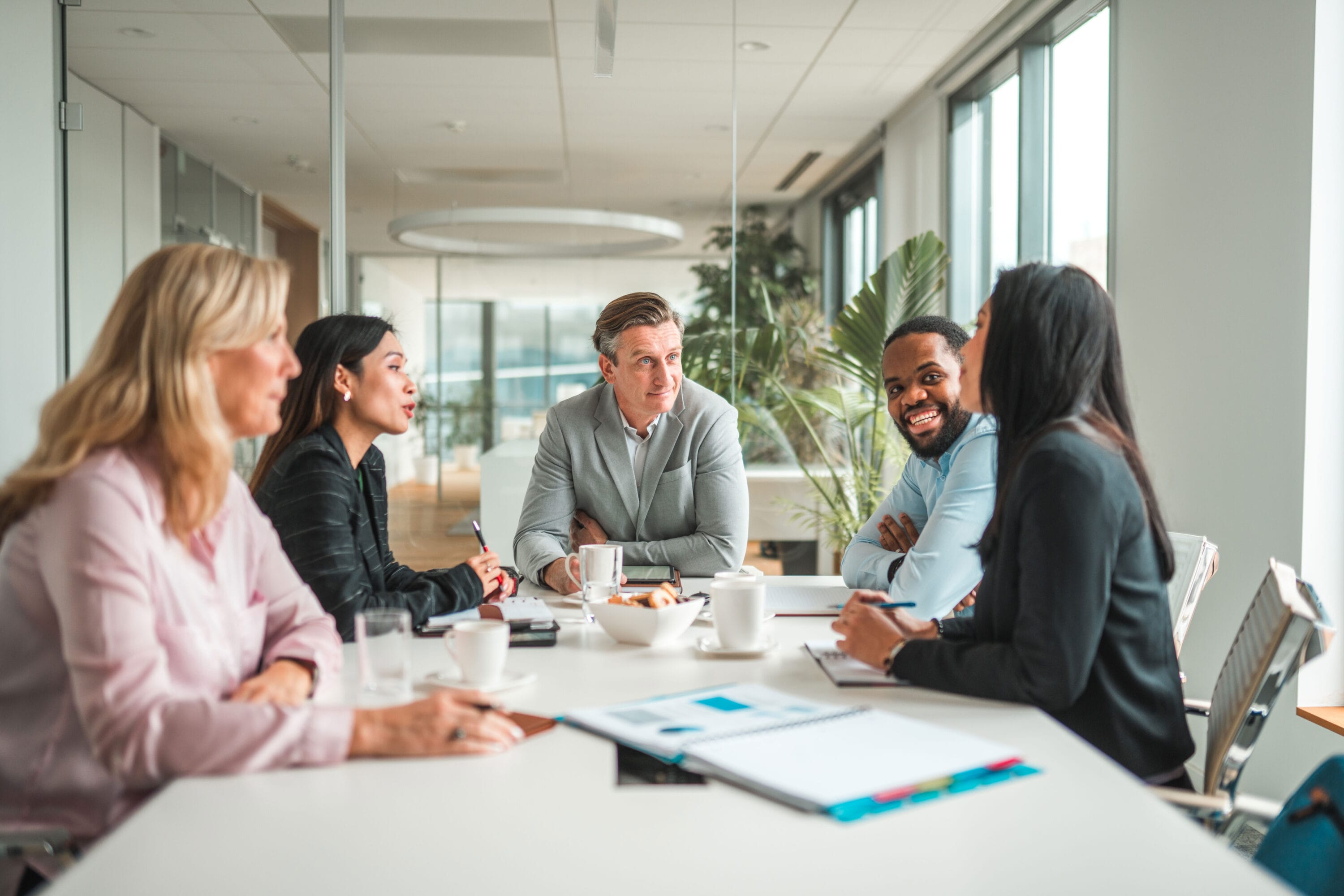 A group of people holding a business meeting.