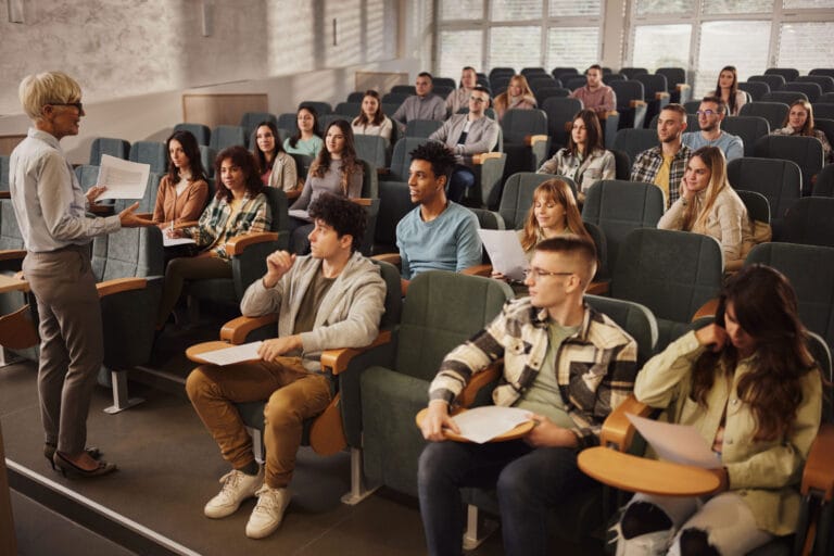 A class of college students in a lecture hall.