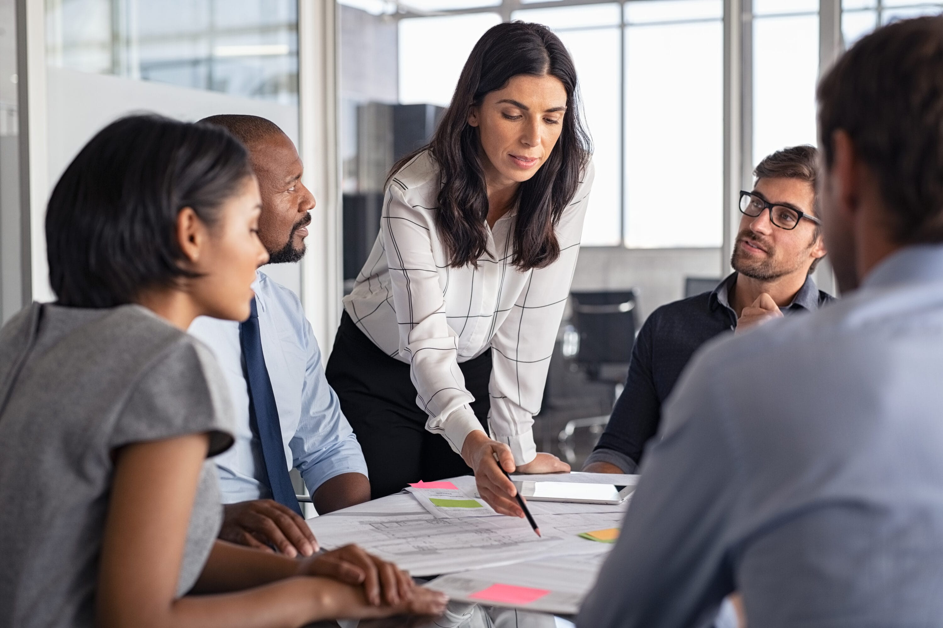 A group of professionals holding a meeting.