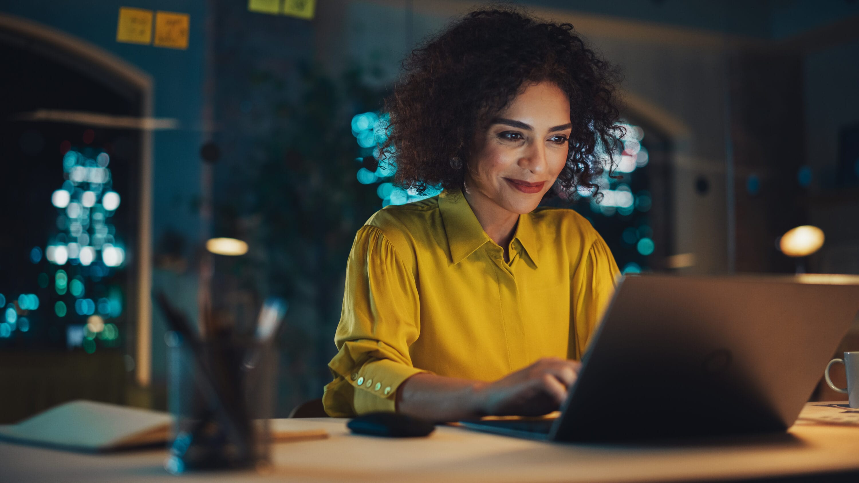 A woman working on her laptop.